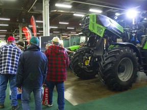 Attendees at the London Farm Show at the Western Fair in 2013. This year's farm show, which was to be held in mid-March, has been cancelled because of concerns related to the ongoing pandemic. Mike Hensen/Postmedia