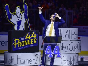 Former St. Louis Blues defenceman Chris Pronger salutes the fans as he chugs a beer before his jersey is retired prior to a game between the St. Louis Blues and the Nashville Predators at Enterprise Center.