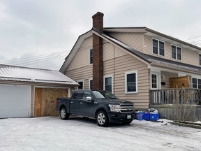 One of the garage doors at a Watson Street apartment complex is boarded up on Thursday, Jan.  6, 2022, in Sarnia, Ont.  (Terry Bridge / Sarnia Observer)