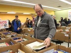 Dwayne Joleun browses at the Rotary Club of Sarnia Bluewaterland used book sale in January, 2020 at the Bayside Centre in downtown Sarnia. Aims are for a pop-up, smaller-scale sale to return in March after 2021's was cancelled amid COVID-19, a club official says.