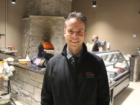 Dean Troiani, of Sarnia Produce, stands near the wood-fired pizza oven in the company's new retail market on Lite Street in Point Edward. Troiani was named Entrepreneur of the Year for the Sarnia Lambton Chamber of Commerce 2021 Ontario Business Achievement Awards.