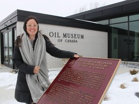 Erin Dee-Richard, curator-supervisor at the Oil Museum of Canada, stands outside the site's main building in Oil Springs.