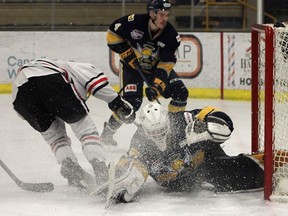 The Spruce Grove Saints defeated the Whitecourt Wolverines 5-2 on Tuesday. Here goaltender Tristan Martin sprawls to make a save.