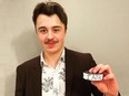 Spruce Grove Saints goaltender Tristan Martin poses with the puck he scored his first career AJHL goal with. The goal makes Martin the second goaltender in league history to accomplish the feat. Photo submitted by the Spruce Grove Saints.