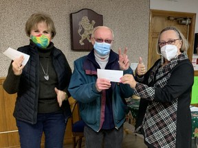 A Port Dover resident is $15,500 richer after winning the Rotary Club of Norfolk Sunrise's latest Catch the Ace lottery. John Lloy, centre, accepted his prize from Judy Buck, left, a member of the Port Dover Legion, and  Gail Bouw of the Rotary Club. CONTRIBUTED PHOTO