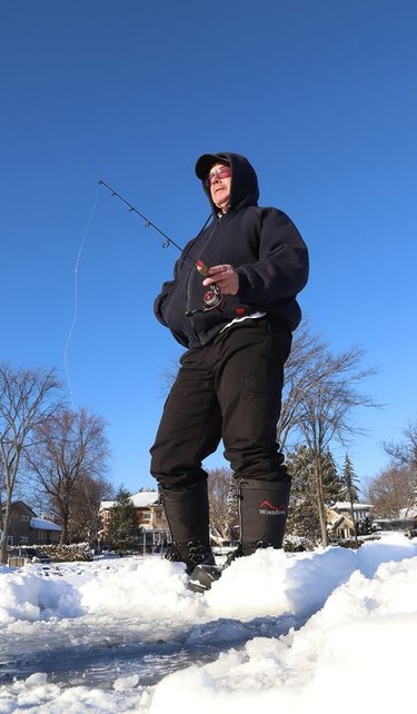 Mark Henry tries his luck at fishing at Ramsey Lake in Sudbury, Ont. on Friday January 7, 2022. John Lappa/Sudbury Star/Postmedia Network