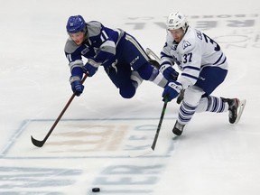 Landon McCallum, left, of the Sudbury Wolves, and Charlie Callaghan, of the Mississauga Steelheads, chase after the puck during OHL action at the Sudbury Community Arena in Sudbury, Ont. on Friday January 7, 2022. John Lappa/Sudbury Star/Postmedia Network