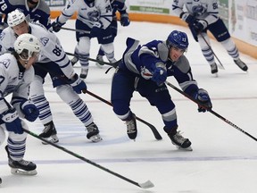 Kocha Delic, right, of the Sudbury Wolves, chases down the puck during OHL action against the Mississauga Steelheads at the Sudbury Community Arena in Sudbury, Ont. on Friday January 7, 2022. John Lappa/Sudbury Star/Postmedia Network