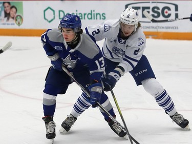 Kocha Delic, left, of the Sudbury Wolves, and Evan Brand, of the Mississauga Steelheads, battle for position during OHL action at the Sudbury Community Arena in Sudbury, Ont. on Friday January 7, 2022. John Lappa/Sudbury Star/Postmedia Network