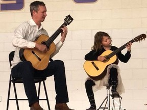 Matt Gould and daughter Sophia play for Music Monday at R.L. Beattie Public School. Supplied