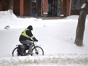 While conditions are not great for cycling at the moment, that didn't stop this hardcore pedaler from forging up Notre Dame Avenue on Wednesday. If you out cycling today, expect snow, a high of -10 degrees C and a low of -30. Jim Moodie/Sudbury Star