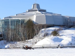 A crew clears snow off the Ramsey Lake skating path in Sudbury, Ont. on Friday January 14, 2022. John Lappa/Sudbury Star/Postmedia Network