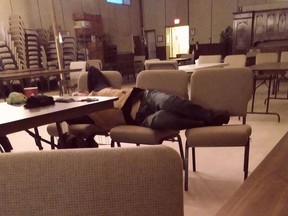 A member of the city's homeless community gets some rest on a makeshift bed in the warming centre at Grace Family Church on the weekend. Supplied