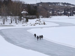 Skaters glide along the skating path on Ramsey Lake in Sudbury, Ont.