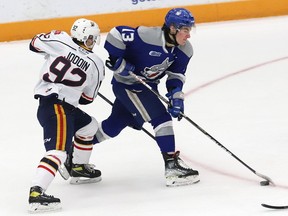 Kocha Delic, right, of the Sudbury Wolves, attempts to skate past Roenick Jodoin, of the Barrie Colts, during OHL action at the Sudbury Community Arena in Sudbury, Ont. on Tuesday January 25, 2022. John Lappa/Sudbury Star/Postmedia Network