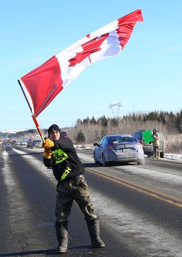 Navin Ayles was on hand to show his support for Freedom Convoy 2022 as it passed through Sudbury, Ont. on Friday January 28, 2022. John Lappa/Sudbury Star/Postmedia Network