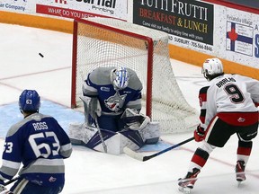 Sudbury Wolves goalie Mitchell Weeks (70) makes a save on Ottawa 67's forward Chris Barlas (9) during first-period OHL action at Sudbury Community Arena in Sudbury, Ontario on Friday, January 28, 2022. Ben Leeson/The Sudbury Star/Postmedia Network