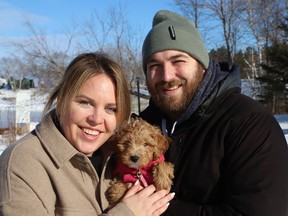 Julie Rochon and Daniel Faubert introduced their two-month-old puppy Ruby, to the outdoors in Sudbury, Ont. on Monday January 31, 2022. John Lappa/Sudbury Star/Postmedia Network