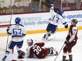 Peterborough Petes' goalie Tye Austin and teammate Samuel Mayer look away as Sudbury Wolves' Kocha Delic celebrates his goal during first period OHL action at the Memorial Centre on Thursday January 13, 2022 in Peterborough, Ont.