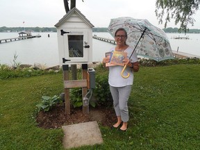 Port Lambton's Anne Hazzard showcases her Little Free Library, which sits along the St. Clair River Parkway. Families are being encouraged to visit nearby Little Free Libraries on Jan. 27 as part of Family Literacy Day activities. File photo/Sarnia This Week
