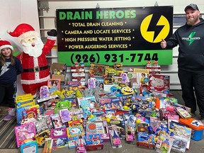 Chris Krauskopf, owner/operator of Drain Heroes in Delhi, and the community came through once again in the second annual Drain Heroes Food and Toy Drive. Handout