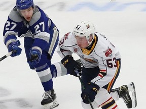 Quentin Musty, left, of the Sudbury Wolves, chases after Beau Jelsma, of the Barrie Colts, during OHL action at the Sudbury Community Arena on Tuesday Jan. 25, 2022.