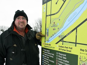 Wallaceburg resident John De Santis points to a trail map posted at Crothers Trail in Wallaceburg on Jan. 25. De Santis says he has a problem with how some trail maps in Wallaceburg are posted because they could give wrong directions.