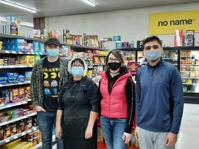 Sushil Motka (right) owns the Rodney Market. He's shown with employees Joseph (left), Marta and Stephanie Rodgers. Larry Scheider photo