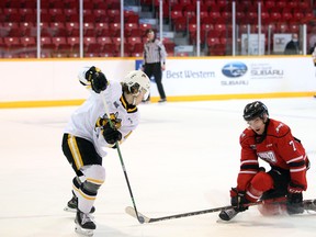 Deni Goure gets low to block an Alexis Daviault outlet pass in the first period as the Owen Sound Attack host the Sarnia Sting inside the Harry Lumley Bayshore Community Centre Sunday, Jan 23, 2022. Greg Cowan/The Sun Times