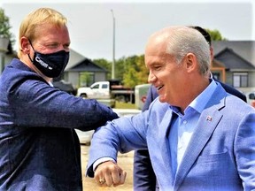 Conservative MP for Bay of Quinte Ryan Williams, left, and Conservative Leader Erin O'Toole share a pandemic elbow greeting in August 2021 during the federal election campaign run-up in Belleville. O'Toole faces a caucus leadership-review vote Wednesday by 119 members of his party. POSTMEDIA FILE