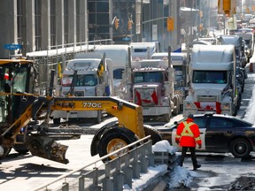 Vehicles continue to block downtown streets in Ottawa on Feb. 1, 2022. Photo via Reuters.