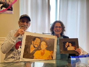 Aime Giroux and Suzanne Pharand show off a painting their grandson Justin created from a 1980 photo of the couple as a present for their 50th wedding anniversary. The two were tragically killed in a collision on Highway 69 on Wednesday.