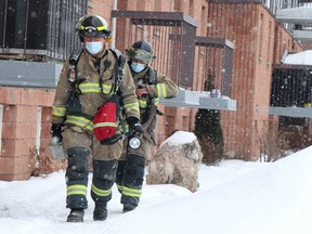 Firefighters respond to a second-floor unit fire at 125 Cambridge Pl., on Saturday, Feb. 5, 2022. (BRIAN KELLY/THE SAULT STAR/POSTMEDIA NETWORK)