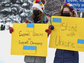 Young women don traditional flower wreaths during a rally in support of Ukraine on Sunday.