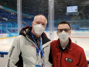 Sudbury Star columnist Randy Pascal, who is working as an off-ice hockey official at the Beijing Winter Olympics, poses for a photo alongside Victor Findlay, who is working at the Games as a rinkside reporter for CBC. Pascal and Findlay worked together at the IIHF World Junior Championship in 2015.