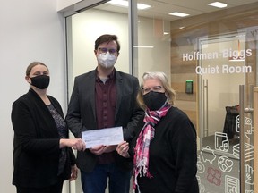 From left to right, Stony Plain Public Library (SPPL) Board of Trustees Chair Shauna Johnstone, Former SPPL Director Mark McHale, and Friends of the Library Chair Carol Humphries accept a check from former Stony Plain resident Leona Hoffman-Bigs. Photo by Jo Anne Hall.