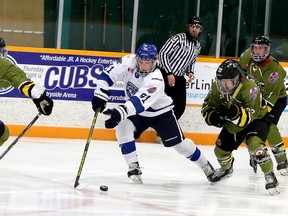 Greater Sudbury Cubs forward Pierson Sobush (91) tries to squeeze between a pair of Powassan Voodoos during first-period NOJHL action at Gerry McCrory Countryside Sports Complex in Sudbury, Ontario on Thursday, February 10, 2022.