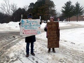 Two women protesting against COVID-19 mandates stand outside Chippewa Secondary School Friday in what was expected to be a potential province-wide school walkout. The Nipissing-Parry Sound Student Transportation Services called a snow day, which kept the majority of high school students at home.
Jennifer Hamilton-McCharles, The Nugget