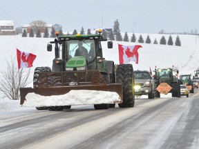 A convoy of tractors, big rigs and other vehicles makes its way along Bruce Rd. 10 between Tara and Allenford on Saturday, February 12,2022. The convoy, held to protest government mandates and shutdowns, which passed through Port Elgin, Southampton, Allenford, Tara, and Burgoyne, stretched approximately five kilometres in length.