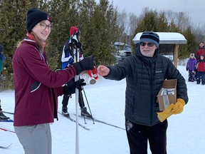 Meghan Raddon from Ecole secondaire catholique Jeunesse-Nord receives her medal after winning the junior girls race at the North Shore Secondary Schools Association cross-country skiing championships last week.