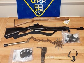 Police seized a variety of weapons, including a machete, brass knuckles and spiked ball during a search in the Thessalon First Nation on Monday.