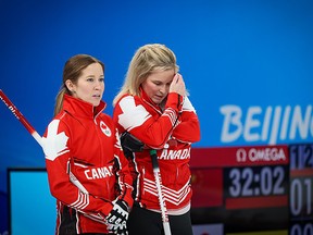 Team Canada’s Kaitlyn Lawes and Jennifer Jones talk during their game against Russia at the Beijing 2022 Winter Olympics. PHOTO BY GAVIN YOUNG /Postmedia