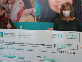 A representative of the Canadian Mental Health Association chapter in Sudbury accepts a cheque from a member of the Sudbury Freedom Convoy earlier this week. The CMHA has now returned the funds. Facebook photo