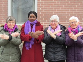 Jan Sosiak, Jackie Dibben, Pamela Park and Mieke Thorne, members of GRANquinte, Quinte Grannies for Africa and Amnesty International Quinte, showing the IWD sign for BREAK THE BIAS. Submitted