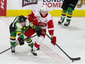 London Knight forward Camaryn Baber checks Soo Greyhound Caeden Carlisle in the first period of their game at Budweiser Gardens on Feb. 19. Baber and the Knights are in town for a two-game weekend series against the Soo Greyhounds.  Derek Ruttan/The London Free Press/Postmedia Network