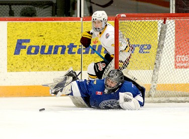Greater Sudbury Cubs goalie Jake Marois reaches out with his stick to cover a rebound before Timmins Rock forward Nicolas Pigeon can pounce on the rebound during the second period of Monday afternoon’s NOJHL contest at the McIntyre Arena. The Cubs scored three third-period goals en route to a 6-3 win over the Rock. THOMAS PERRY/THE DAILY PRESS