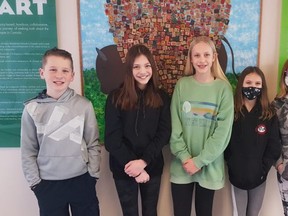 (Left to right) Pine Street Elementary Grade 6 students Joel Kern, Charlee Drover, Elle Tingstad, Nina Constantinos, and Eva Schmidt stand in front of the school’s Project of Heart display. Photo Supplied