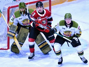 Goaltender Dom DiVincentiis and Ty Nelson of the North Bay Battalion guard the front of the net as Tyler Boucher of the host Ottawa 67's trespasses in Ontario Hockey League action Sunday.  The Troops played the first of four straight road games.
Sean Ryan Photo