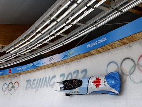 Team Canada competes in 4-man Heat at the National Sliding Centre during the 2022 Beijing, Winter Olympics on February 19, 2022. REUTERS/Thomas Peter