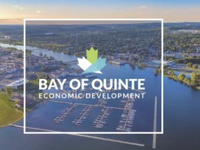 An aerial photo of Trenton is seen behind a logo for the Quinte Economic Development Commission. Submitted.